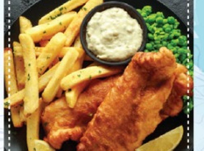 Battered fish with chips, peas and sauce